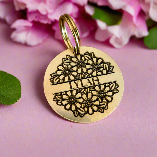 Beautiful brass gold pet ID tag with flowers and a name