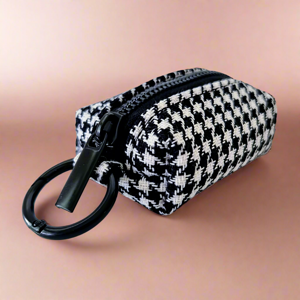 Dog poop bag holder with houndstooth pattern 