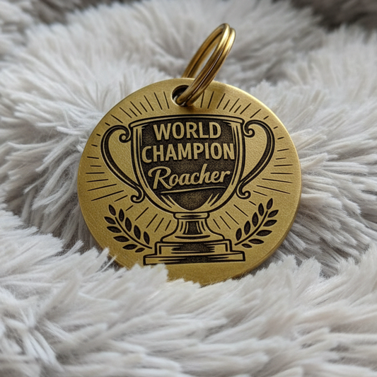 Solid brass dog tag with 'World Champion Roacher' engraved on it
